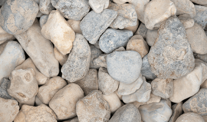 Loose display of shingle, a flint aggregate, graded from 20mm to 40mm, showcased dry.