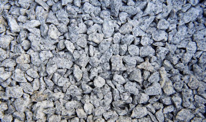 Loose display of silver grey chippings, graded from 6mm to 14mm, containing black, silver and quartz chippings, showcased dry.