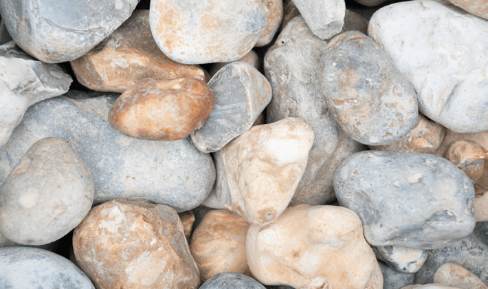 Reject shingle, quarried or dredged flint-based aggregate, displayed dry.